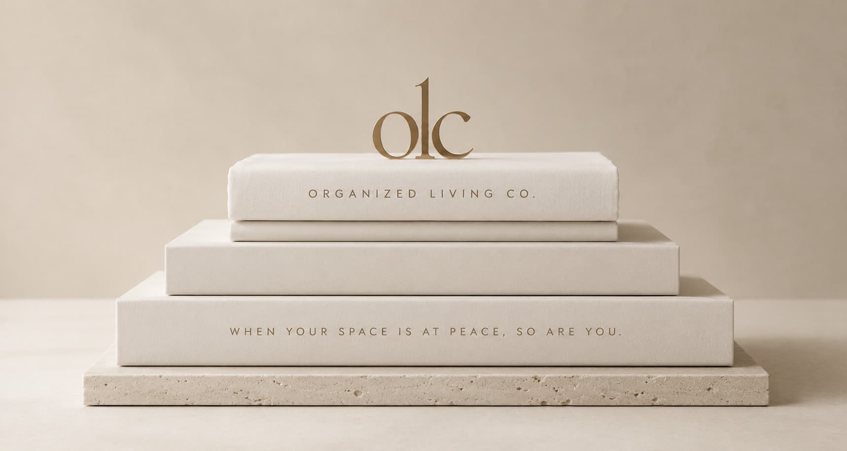 The gold OLC logo styled atop stacked storage boxes